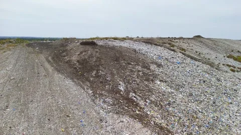 Aerial View of a Landfill in a Rural Area Surrounded by Forests and Farmland, En Stock Footage 293174455