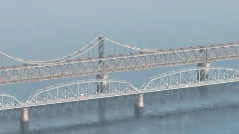 Aerial view of landscape of amnok river broken bridge in Dandong city China Stock-Footage 266969312