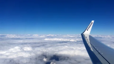 Aerial view landscape, clouds and sky as seen through window of an airplane. 4K 스톡 동영상 105098180