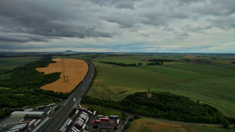Aerial view landscape of farm fields near highway gas station and truck parking. Stock Footage 159913801