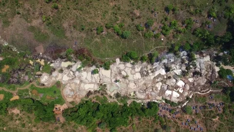 Aerial view of a landscape with mining pits and surrounding vegetation and small Stock Footage 307896416