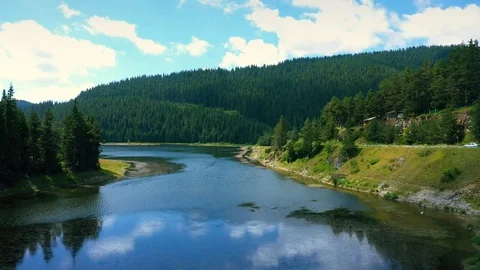 Aerial View of landscape with mountains, forest and lake.  Stock Footage 114302188