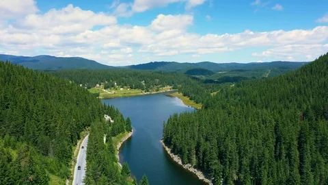 Aerial View of landscape with mountains, forest and lake.  Stock Footage 114302345