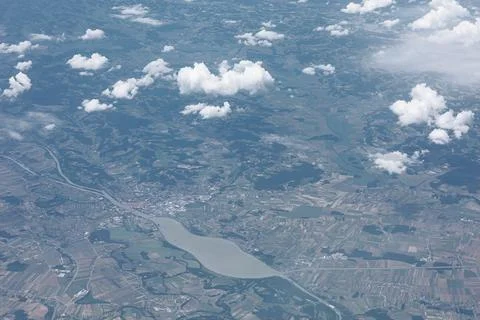 Aerial view of landscape with patchwork fields and clouds 스톡 사진