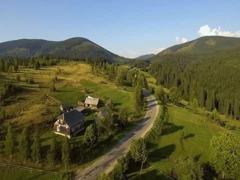 Aerial view of the landscape with small village in mountains Stock Footage