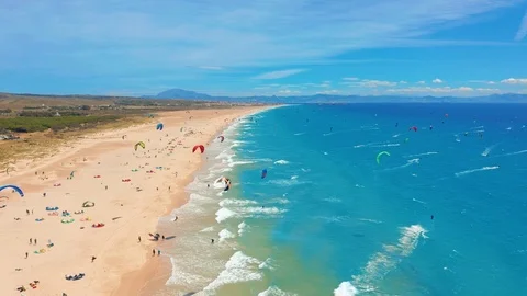 Aerial view. a large beach filled with kite surfers in tarifa, Spain. Stock Footage 109575837