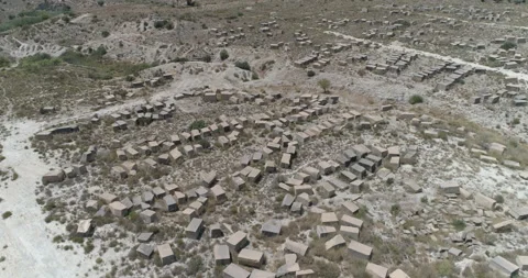 Aerial view of large blocks of stone abandoned in the desert Stock Footage 210232541