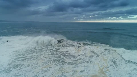 Aerial view of large breaking waves at Nazare, Portugal. Stock Footage 346658707