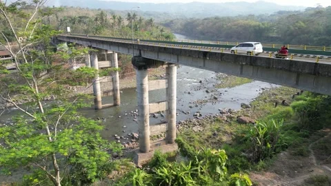 Aerial view of a large bridge built with sturdy and strong concrete pillars Video stock 290940433