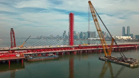 Aerial view of a large bridge over the river is in the process of being Video stock 335643537