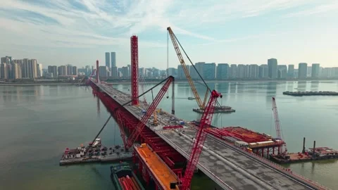 Aerial view of a large bridge over the river is in the process of being Vídeo Stock 335643574