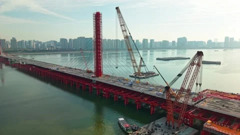 Aerial view of a large bridge over the river is in the process of being Stock-Footage 335643576
