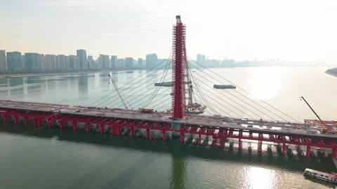 Aerial view of a large bridge over the river is in the process of being Stock Footage 335643595