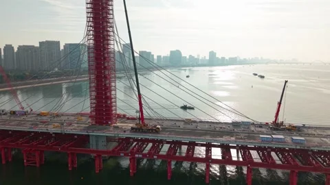 Aerial view of a large bridge over the river is in the process of being Stock Footage 335643616