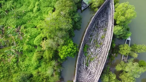 Aerial view of a large broken boat parked on the river bank Stock Footage 246777648
