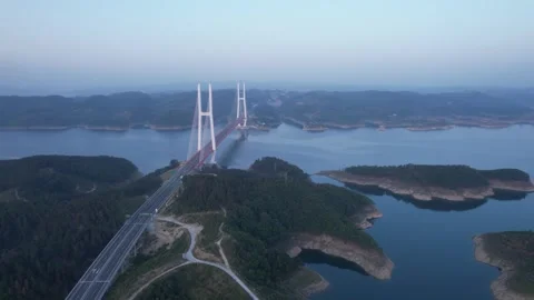 Aerial view of a large cable stayed bridge crossing a vast calm reservoir 스톡 동영상 342324910