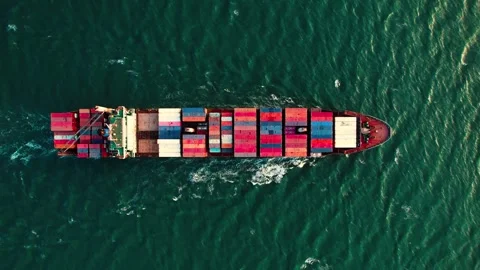 Aerial view of a large cargo container ship sailing on the sea or ocean for Stock Footage 275012029
