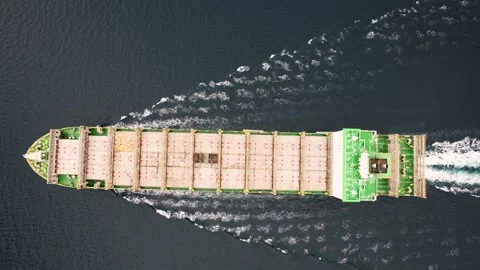 Aerial view of a large cargo ship sailing on the sea or blue ocean for logistics Stock Footage 267065603