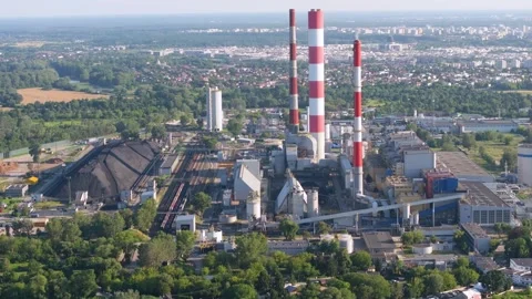 Aerial view of a large coal fired power plant with smokestacks Stock Footage 344879828