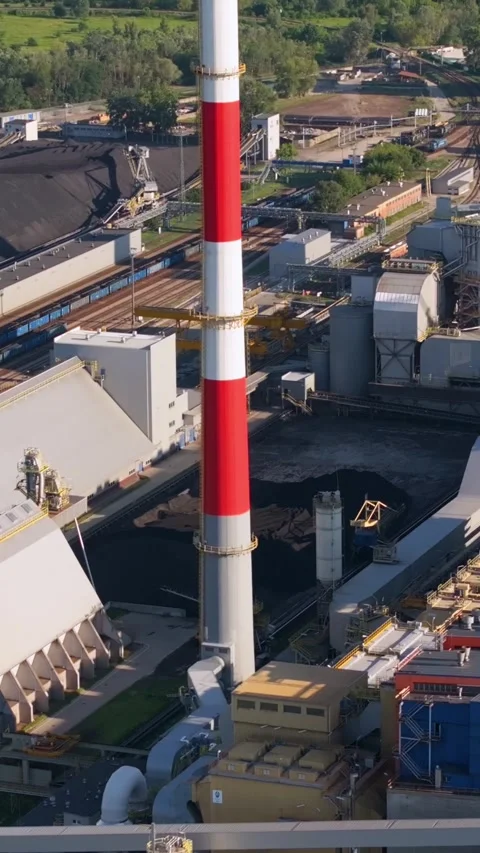 Aerial view of a large coal fired power plant. Vertical video Stock Footage 345654436