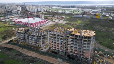 Aerial view of a large construction site with two multi-storey residential build Stock Footage 330937249