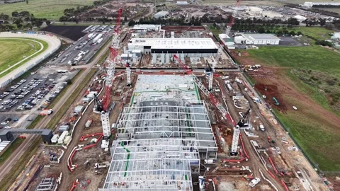 Aerial view of a large construction site with cranes building a warehouse Stock-Footage 340503610