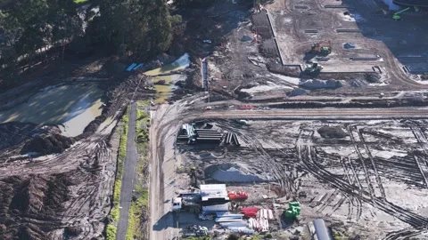 Aerial view of a large construction site with heavy machinery Stock Footage 341254711