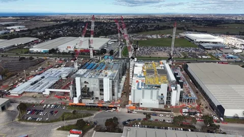 Aerial view of a large construction site with industrial buildings and cranes 스톡 동영상 341919060