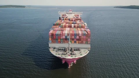 Aerial view large container cargo ship traveling with speed over blue ocean Stock Footage 254510879