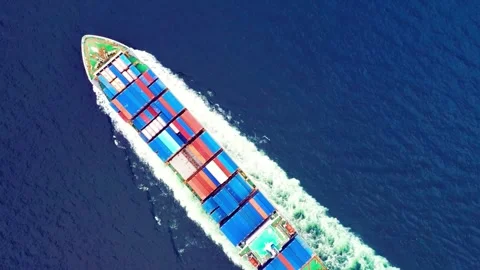 Aerial view of a large container cargo ship traveling on the blue sea Stock Footage 332870028