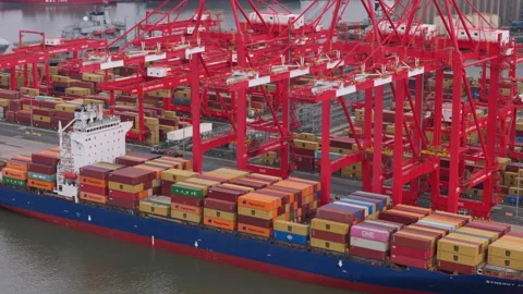 Aerial view of large container ship being loaded and unloaded. Stock Footage 285797014