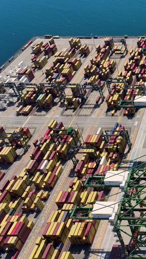 Aerial view of large container terminal with shipping containers and cargo ship Video stock 340235431