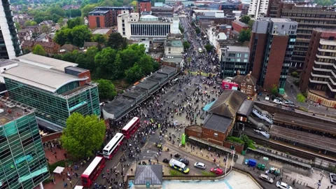 Aerial View of Large Crowd and Buses Parade Celebrating in City Street Video stock 334941659
