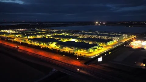 Aerial view of a large data center at night with cooling towers Stock Footage 340350064