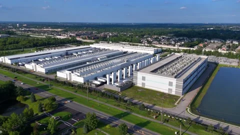 Aerial view of a large data center complex and network infrastructure in 動画素材 346654635