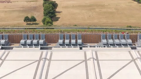 Aerial View of a Large Data Center Facility With Cooling Units and Rooftop Vents Stock Footage 347349254