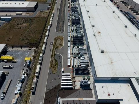 Aerial view of a large data center facility and cooling equipment Stock Photos