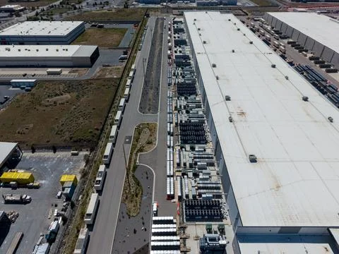 Aerial view of a large data center facility and cooling equipment Stock Photos