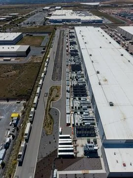 Aerial view of a large data center facility and cooling equipment Stock Photos