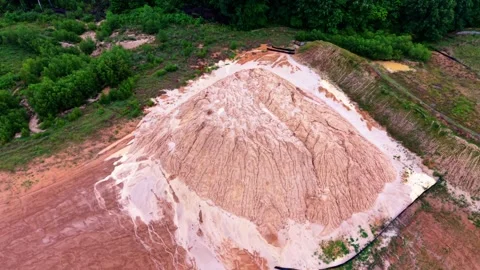 Aerial view of a large dirt and sand stockpile. Video stock 334325893