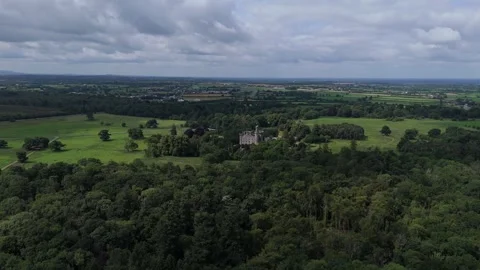 An aerial view of a large estate with trees and a castle Video stock 328522964