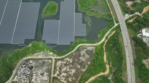 Aerial View of a Large Floating Solar Farm Near Highway Stockbeeldmateriaal 337330893
