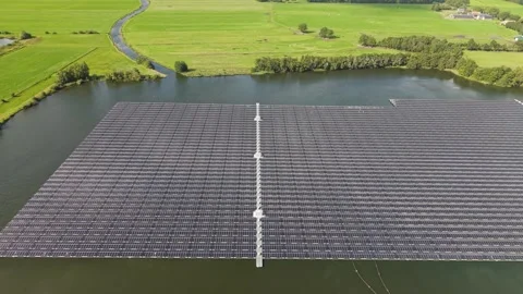 Aerial view of a large floating solar park on a lake in Beilen, Netherlands Stock Footage 346135848