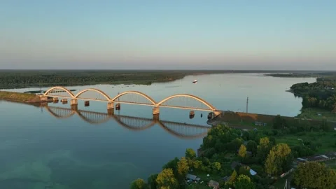 Aerial view. A large four-arch bridge over the river. A beautiful railway bridge Stock Footage 234474419
