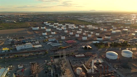 Aerial View of Large Fuel Storage Tank Farm and Refinery Facilities Stock Footage 334950595