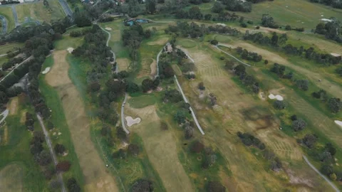 Aerial view of a large golf course on a sunny day Vídeos de archivo 342522890