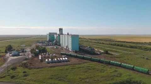 Aerial view of a large grain elevator connected to railway freight... Stock Footage 342732188
