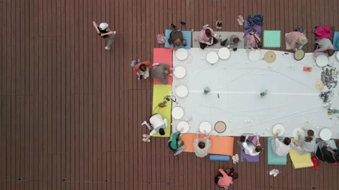 Aerial view of a large group of people learning the art of drawing with paints Stock Footage 194429888