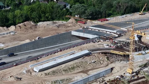 Aerial View of Large Highway Bridge Construction Site with Tower Cranes Stock Footage 342052923