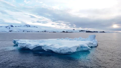 Aerial view of a large iceberg floating in antarctic waters Stock Footage 320594949